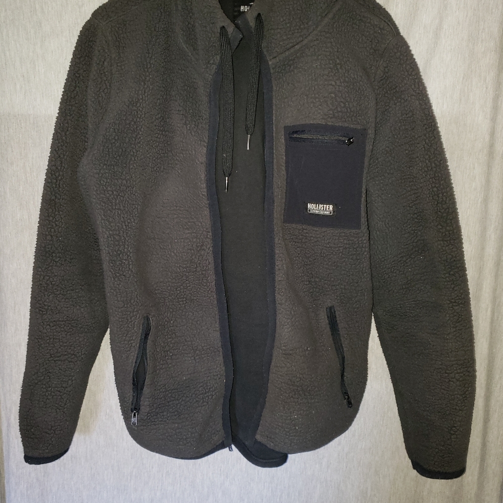 Mens grey Hollister zip up fleece jacket size medium.